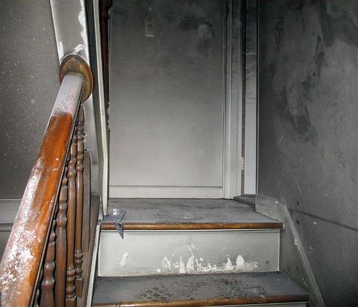 stairs covered in soot after a fire
