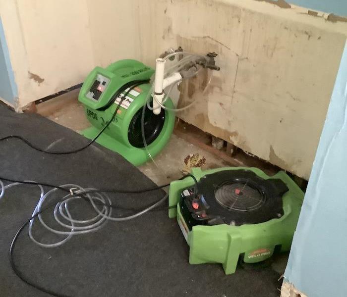SERVPRO equipment drying bathroom with vanity removed