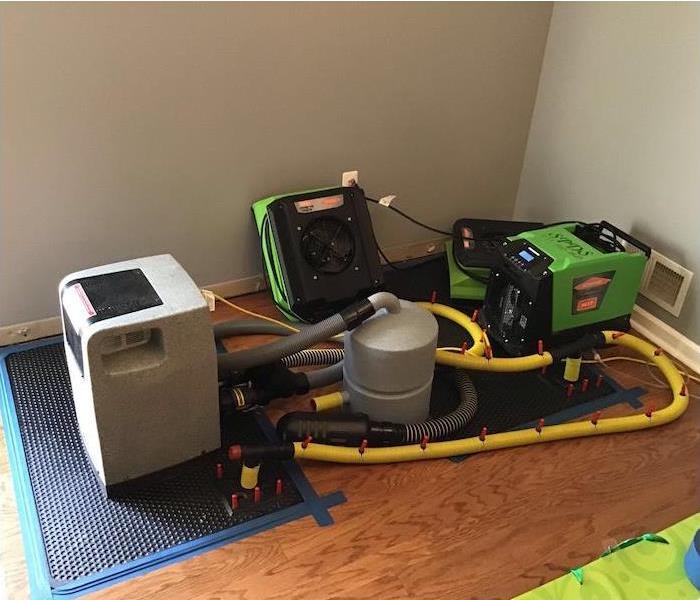 SERVPRO equipment on a water damaged floor